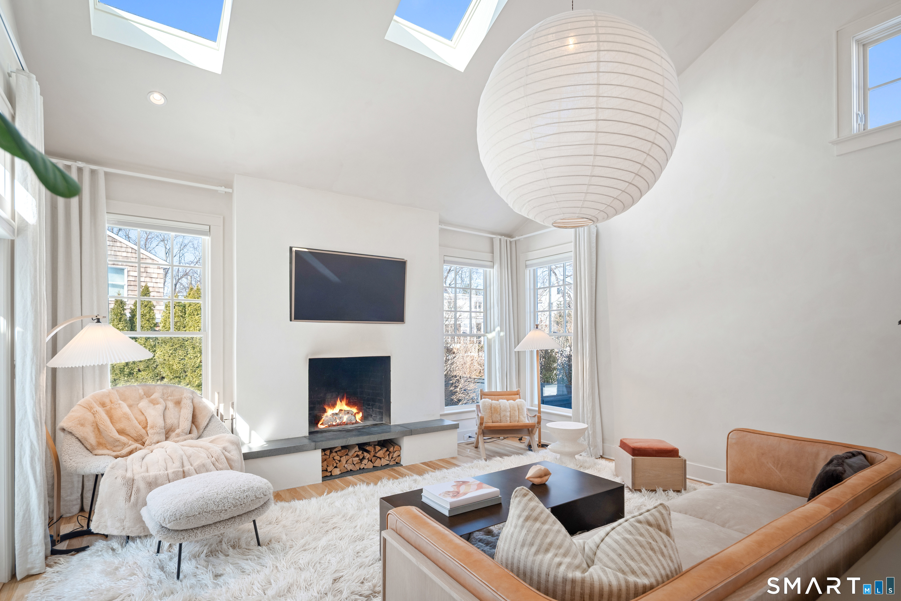 22 Craw Avenue Norwalk, CT 06853 - Photo 7 of 40 a living room with furniture and a fireplace