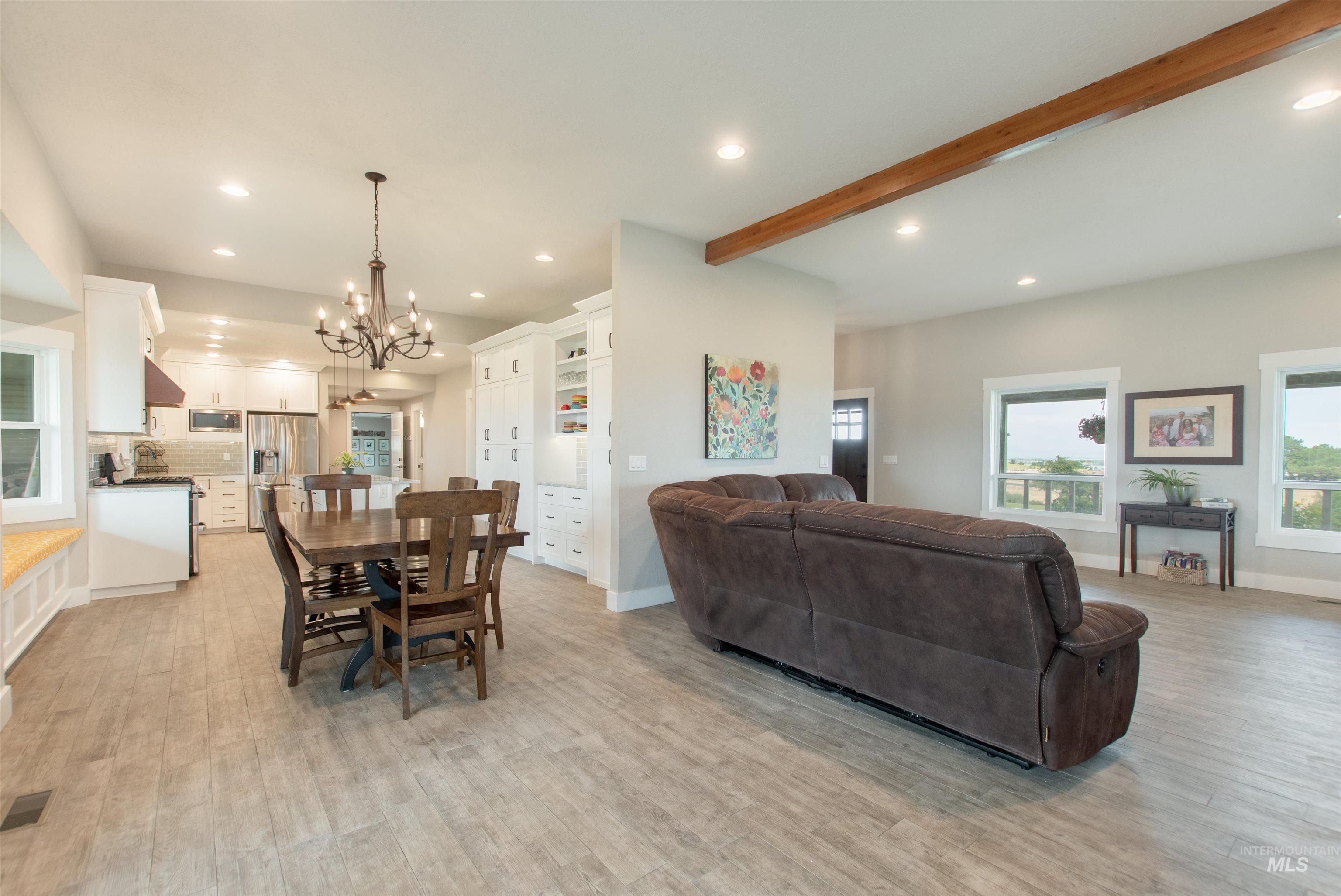 12369 Deer Flat Road Nampa, ID 83686 - Photo 20 of 50 Versatile finished space featuring concrete flooring, multiple rectangular ceiling light fixtures, built-in storage with paneled doors, and a mini-split system