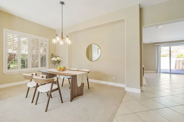 a view of a kitchen with furniture and window