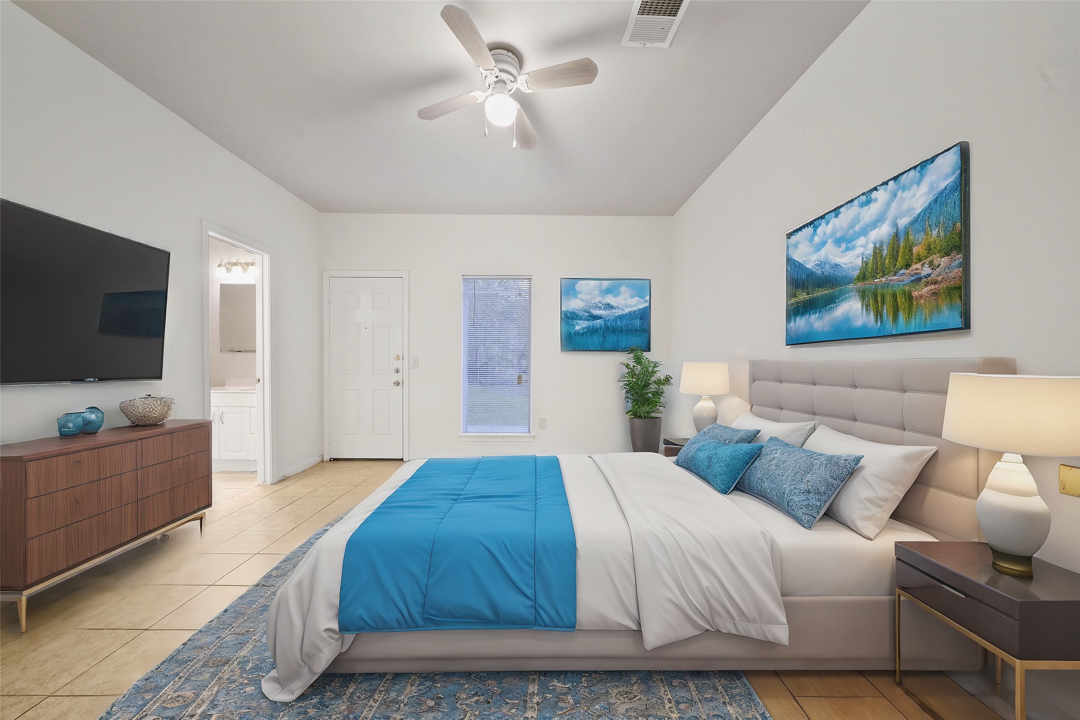 5502 Finch Street, Unit B Houston, TX 77028 - Photo 21 of 37 a spacious bedroom with a bed and a flat screen tv