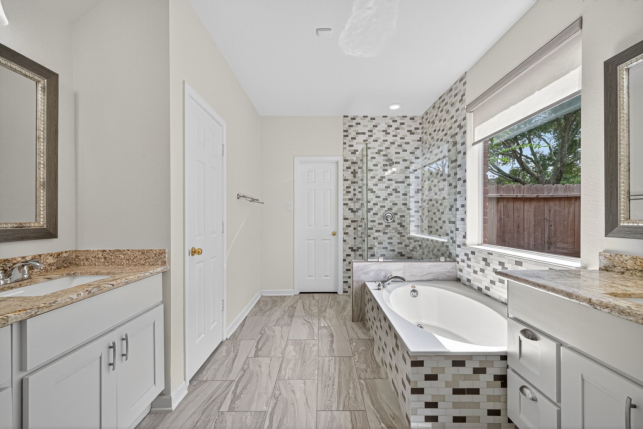 22406 Piper Terrace Lane Katy, TX 77450 - Photo 27 of 44 a bathroom with a granite countertop sink a mirror a vanity and a shower