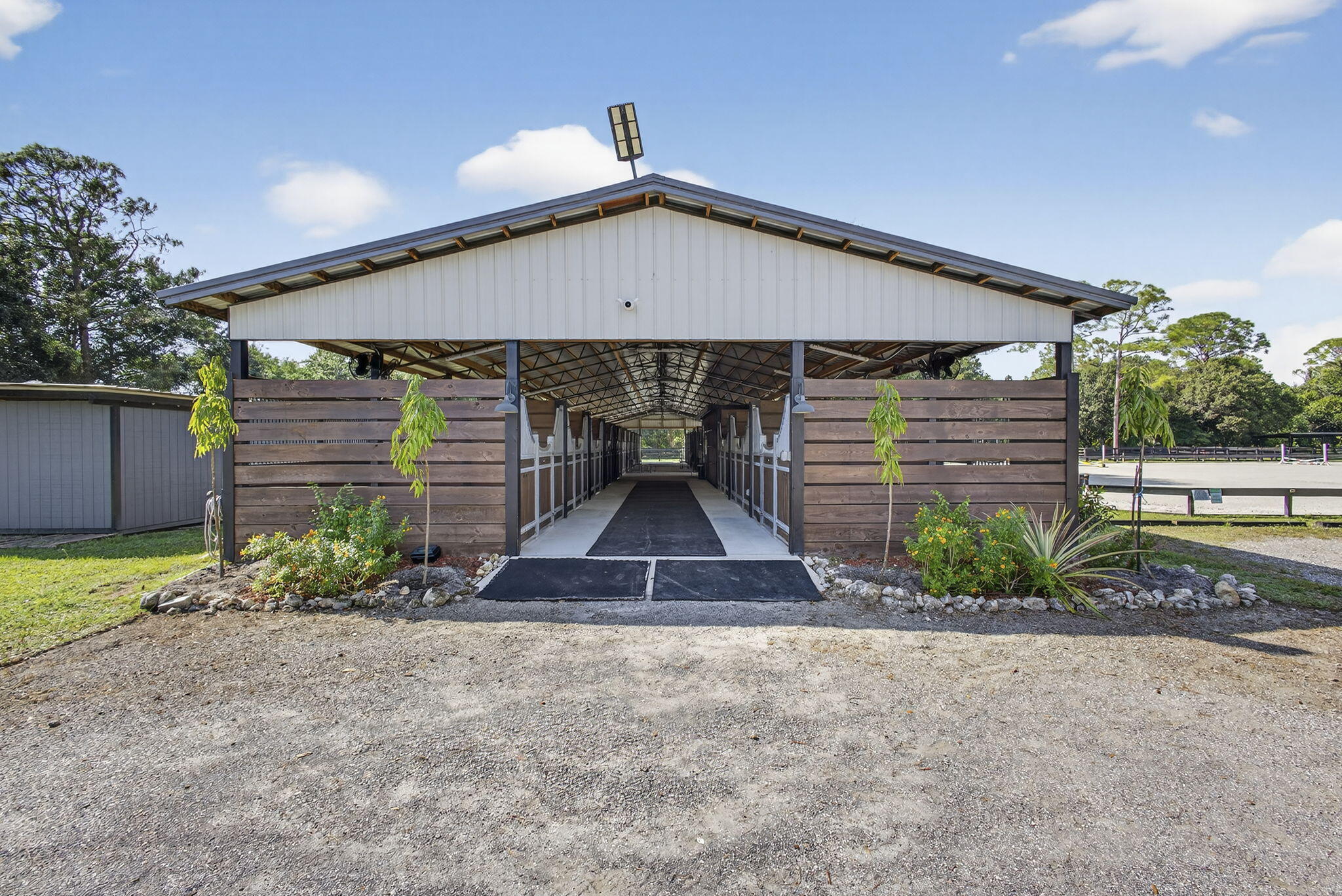 14346 33rd Place North Loxahatchee Groves, FL 33470 - Photo 1 of 40 a front view of a house with garden