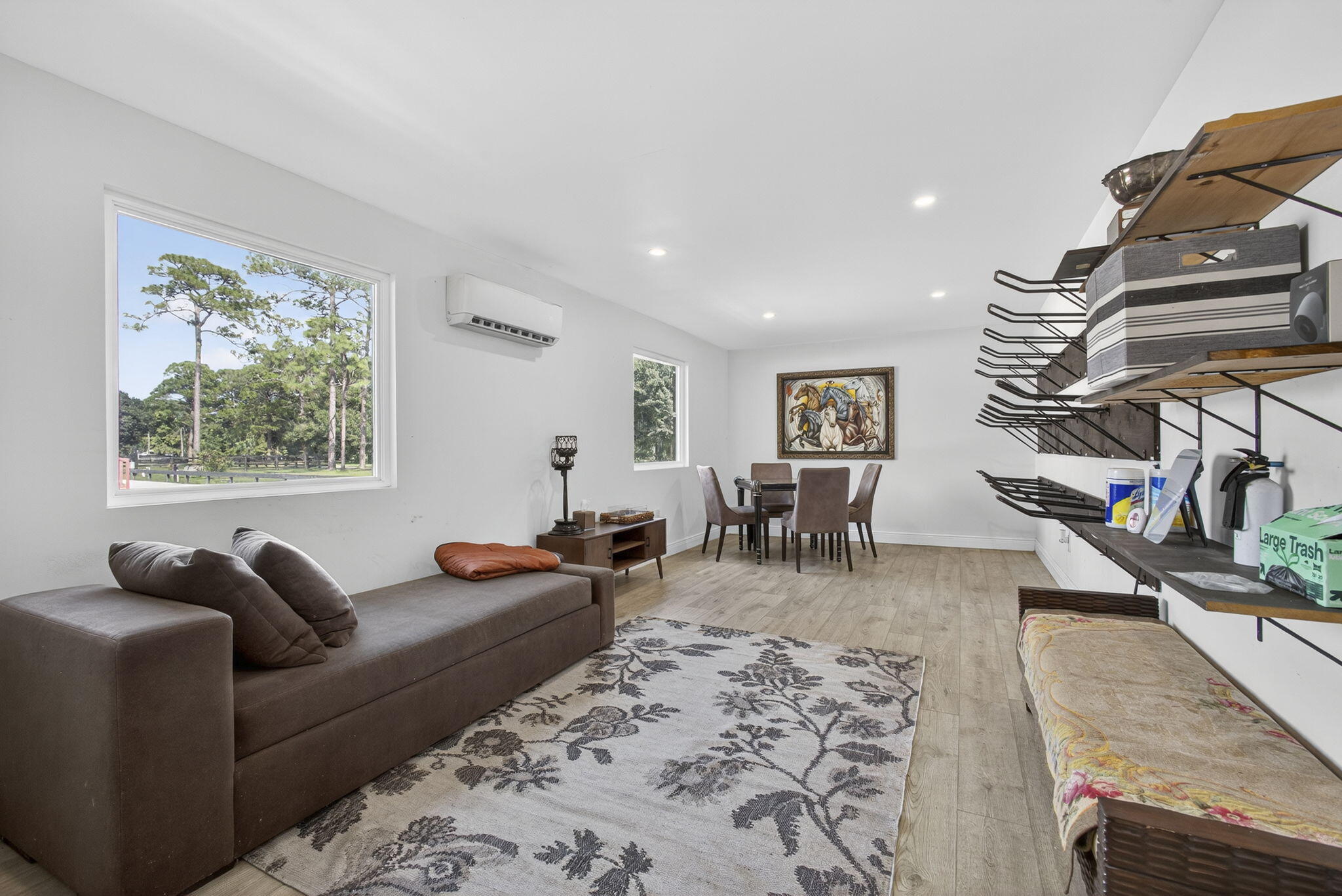 14346 33rd Place North Loxahatchee Groves, FL 33470 - Photo 17 of 40 a living room with furniture a wooden floor and next to a window