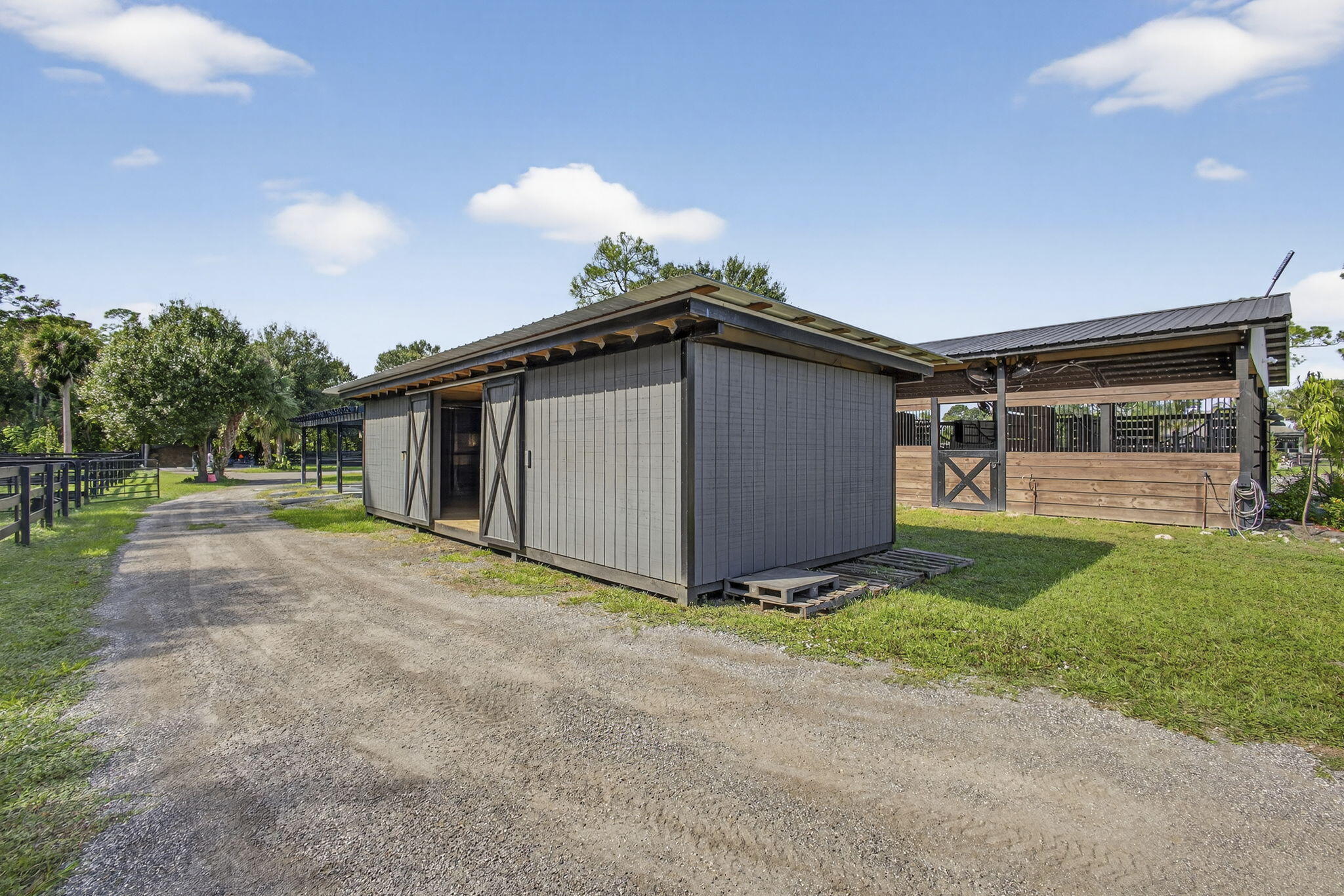 14346 33rd Place North Loxahatchee Groves, FL 33470 - Photo 34 of 40 a view of a house with backyard and garden