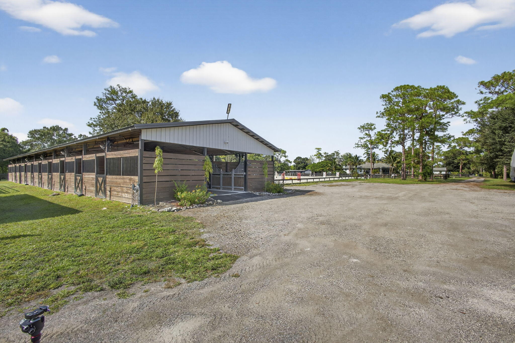 14346 33rd Place North Loxahatchee Groves, FL 33470 - Photo 39 of 40 a view of a house with backyard and a garden