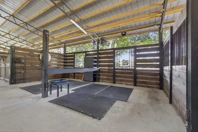 a living room with furniture a wooden floor and next to a window