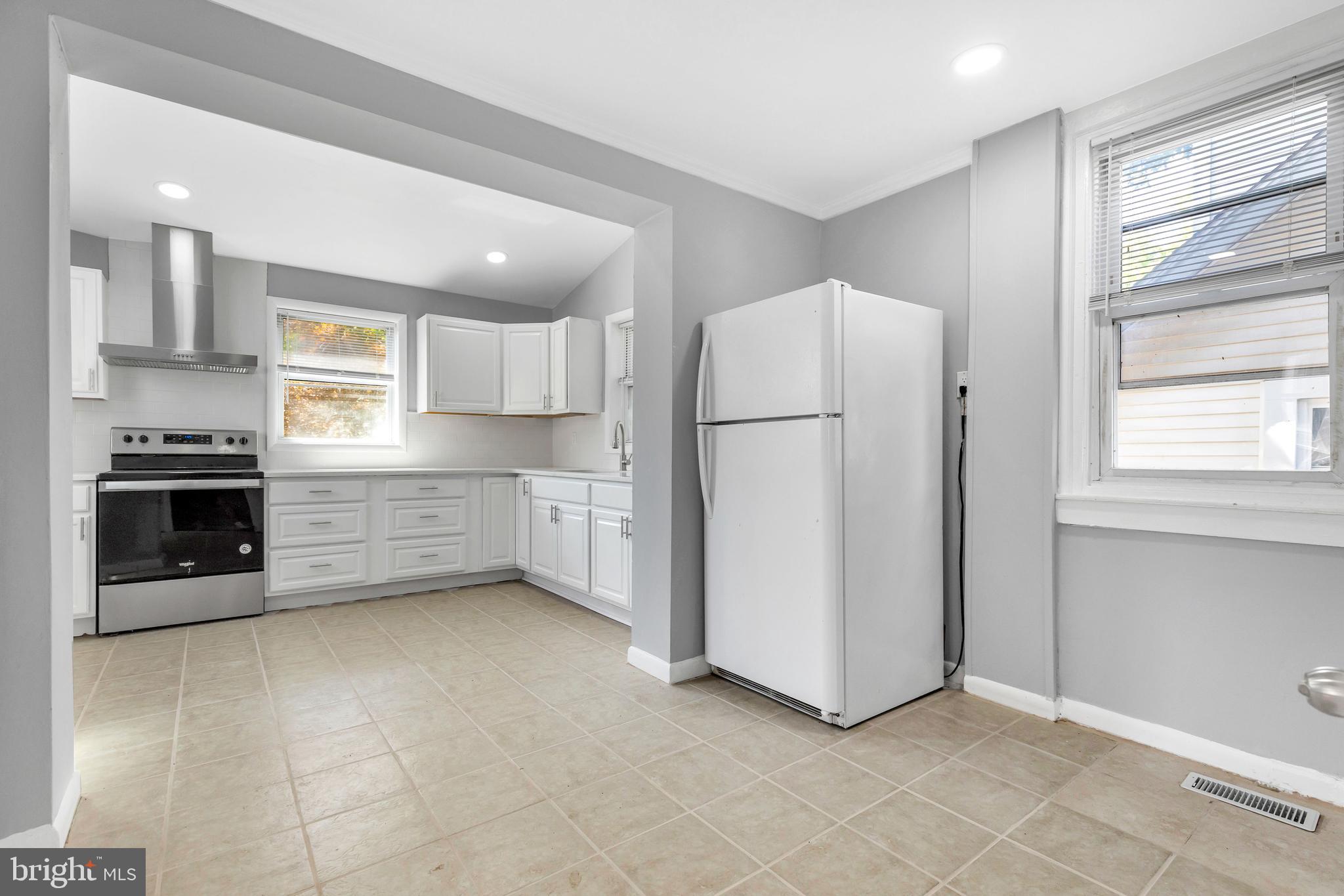 120 Englewood Road Upper Darby, PA 19082 - Photo 11 of 29 a kitchen with stainless steel appliances a refrigerator and a stove top oven
