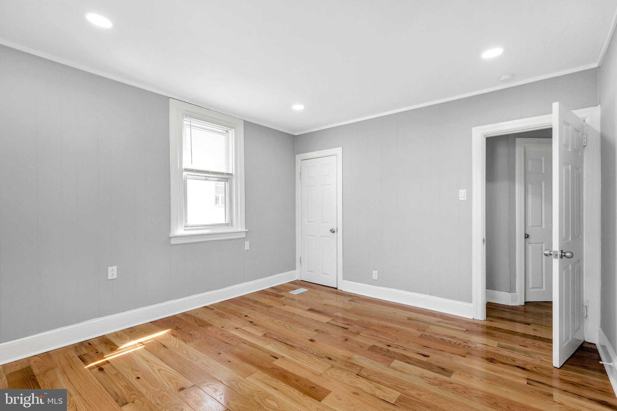 120 Englewood Road Upper Darby, PA 19082 - Photo 14 of 29 a view of empty room with wooden floor and fan