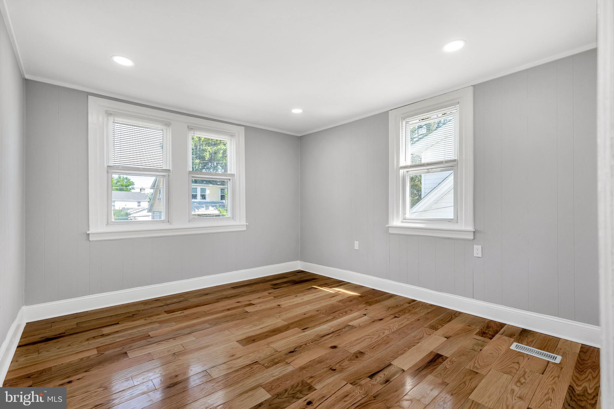 120 Englewood Road Upper Darby, PA 19082 - Photo 15 of 29 a view of empty room with wooden floor and fan