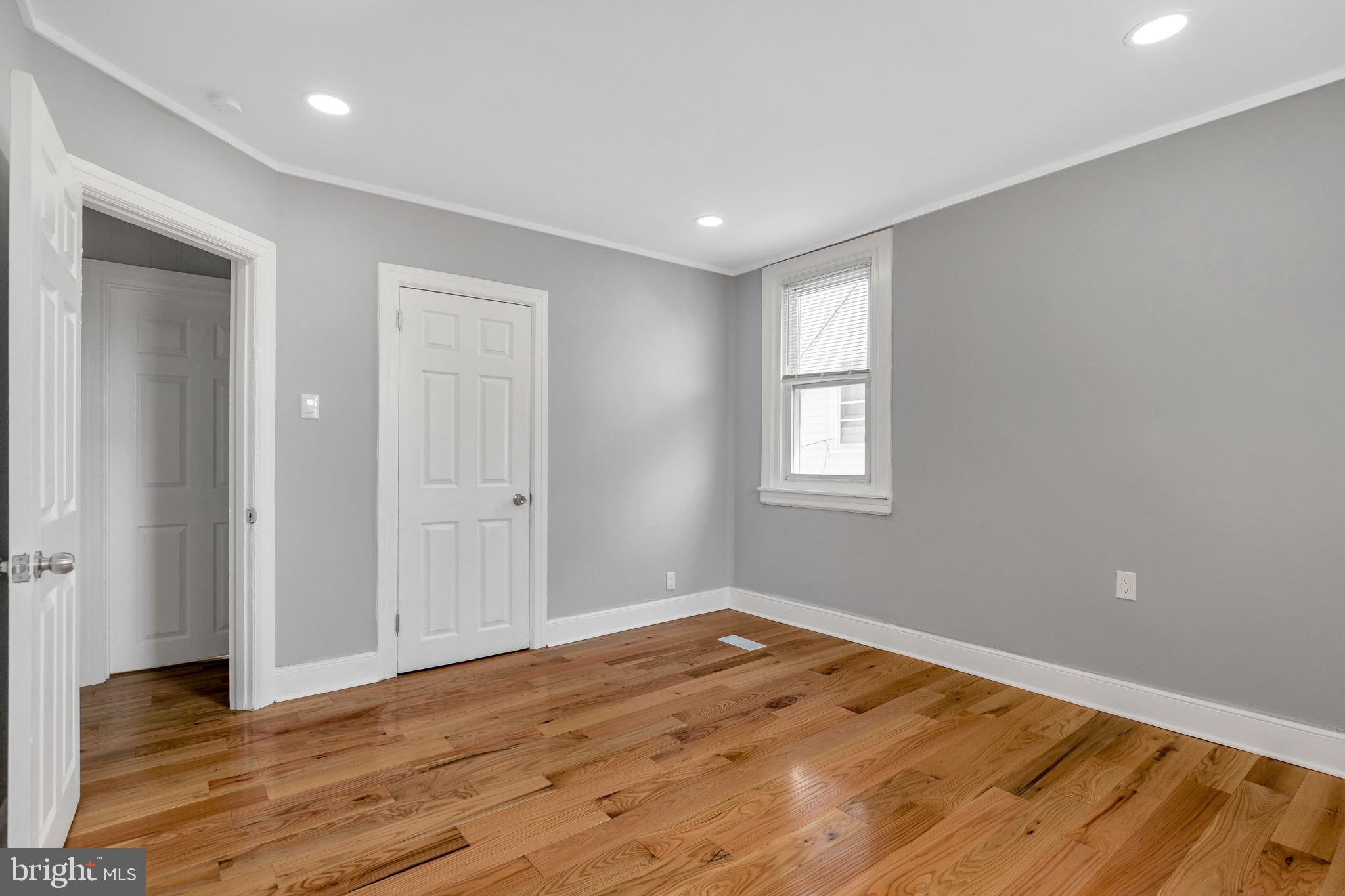 120 Englewood Road Upper Darby, PA 19082 - Photo 16 of 29 a view of empty room with wooden floor and fan