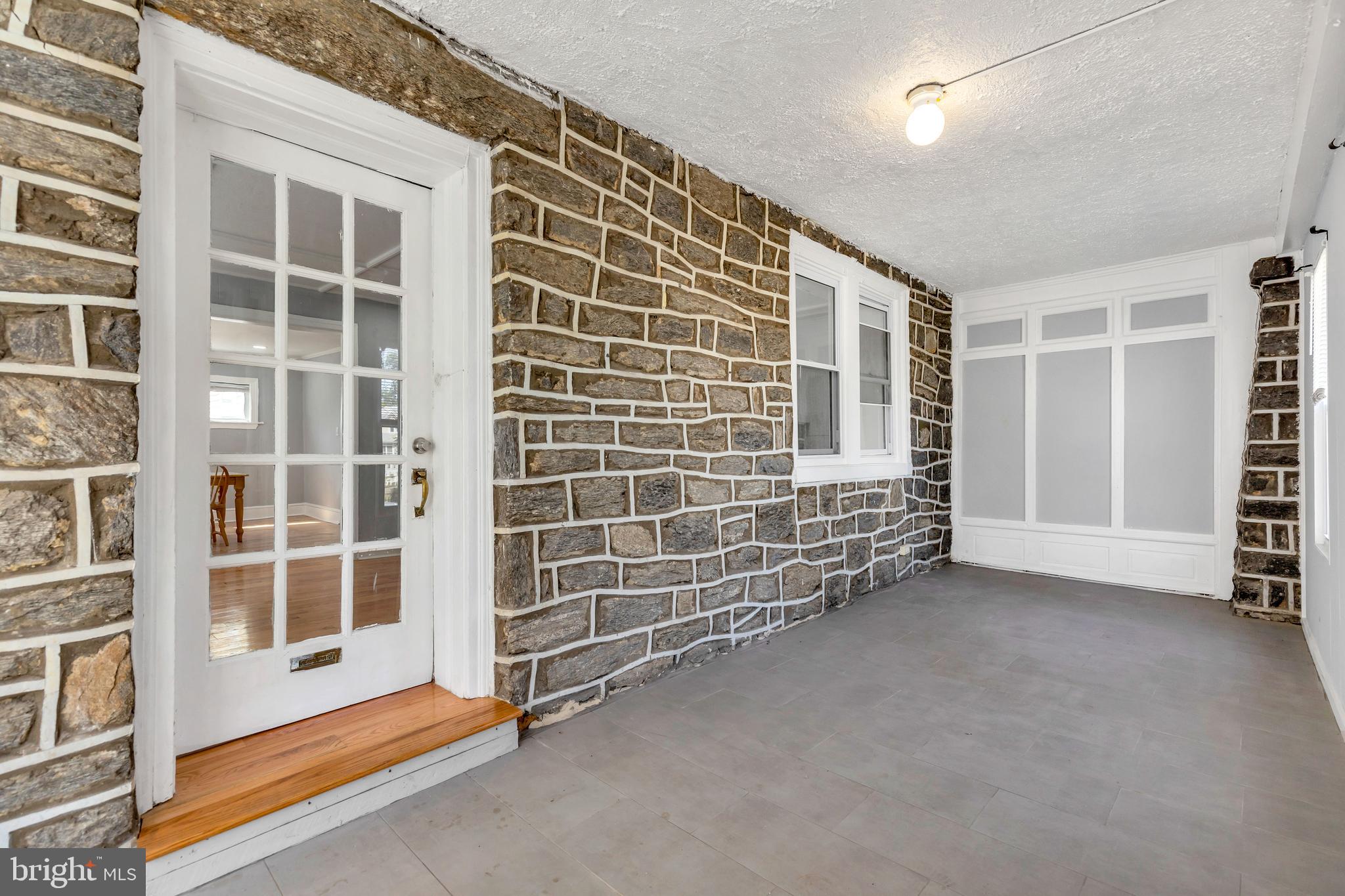 120 Englewood Road Upper Darby, PA 19082 - Photo 3 of 29 a view of an empty room with a balcony and door