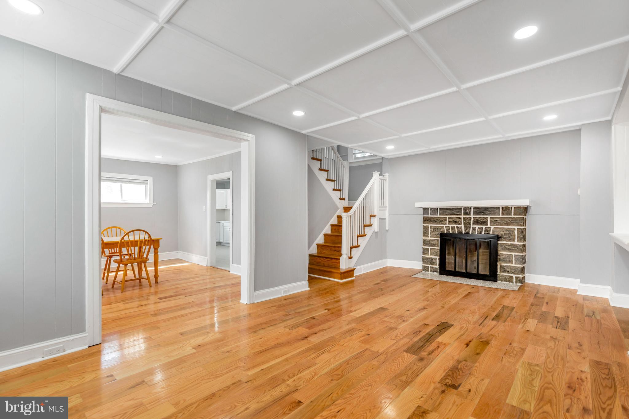 120 Englewood Road Upper Darby, PA 19082 - Photo 5 of 29 a view of a livingroom with a fireplace and workspace