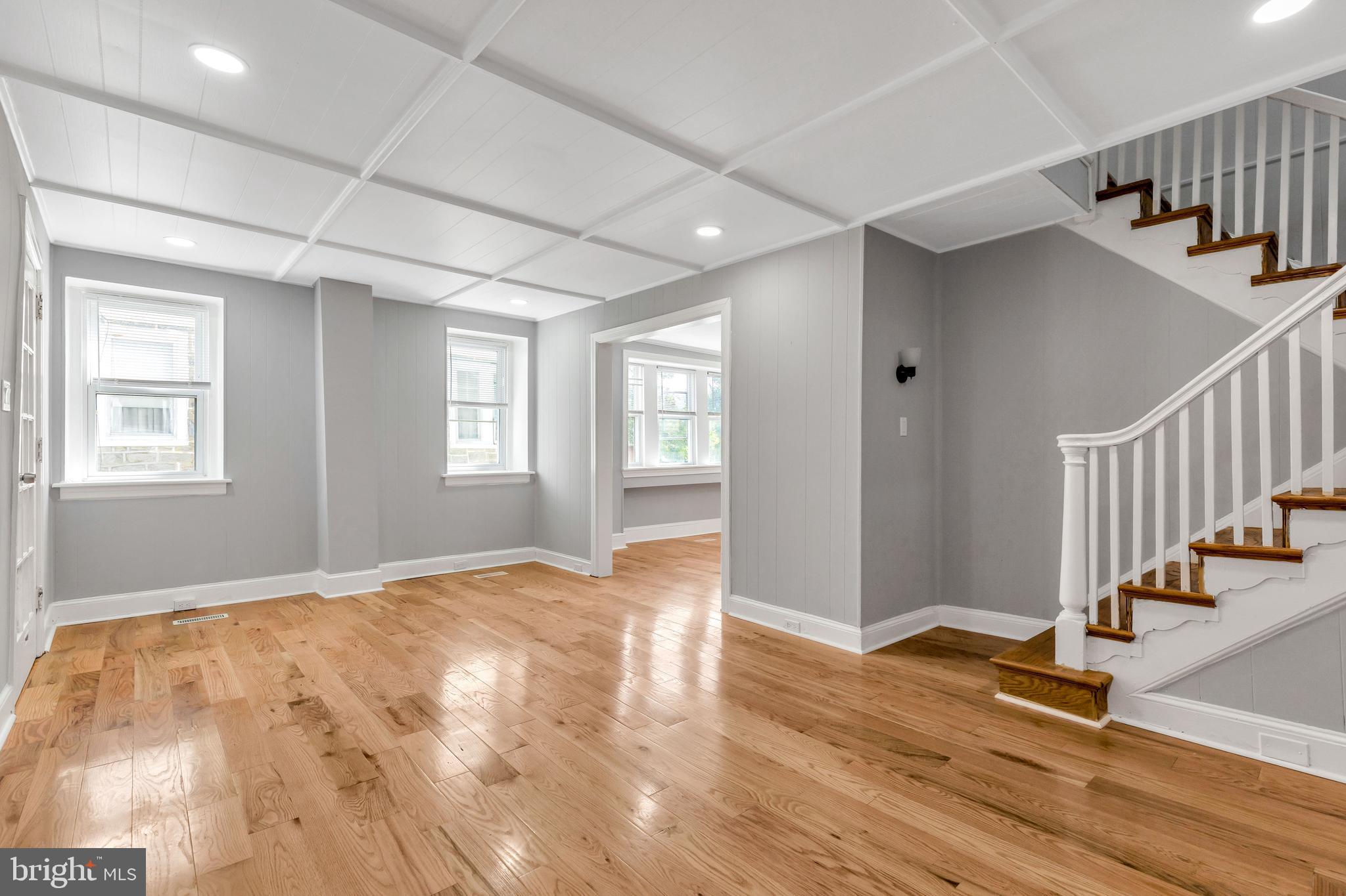 120 Englewood Road Upper Darby, PA 19082 - Photo 6 of 29 a view of an empty room with stairs and wooden floor