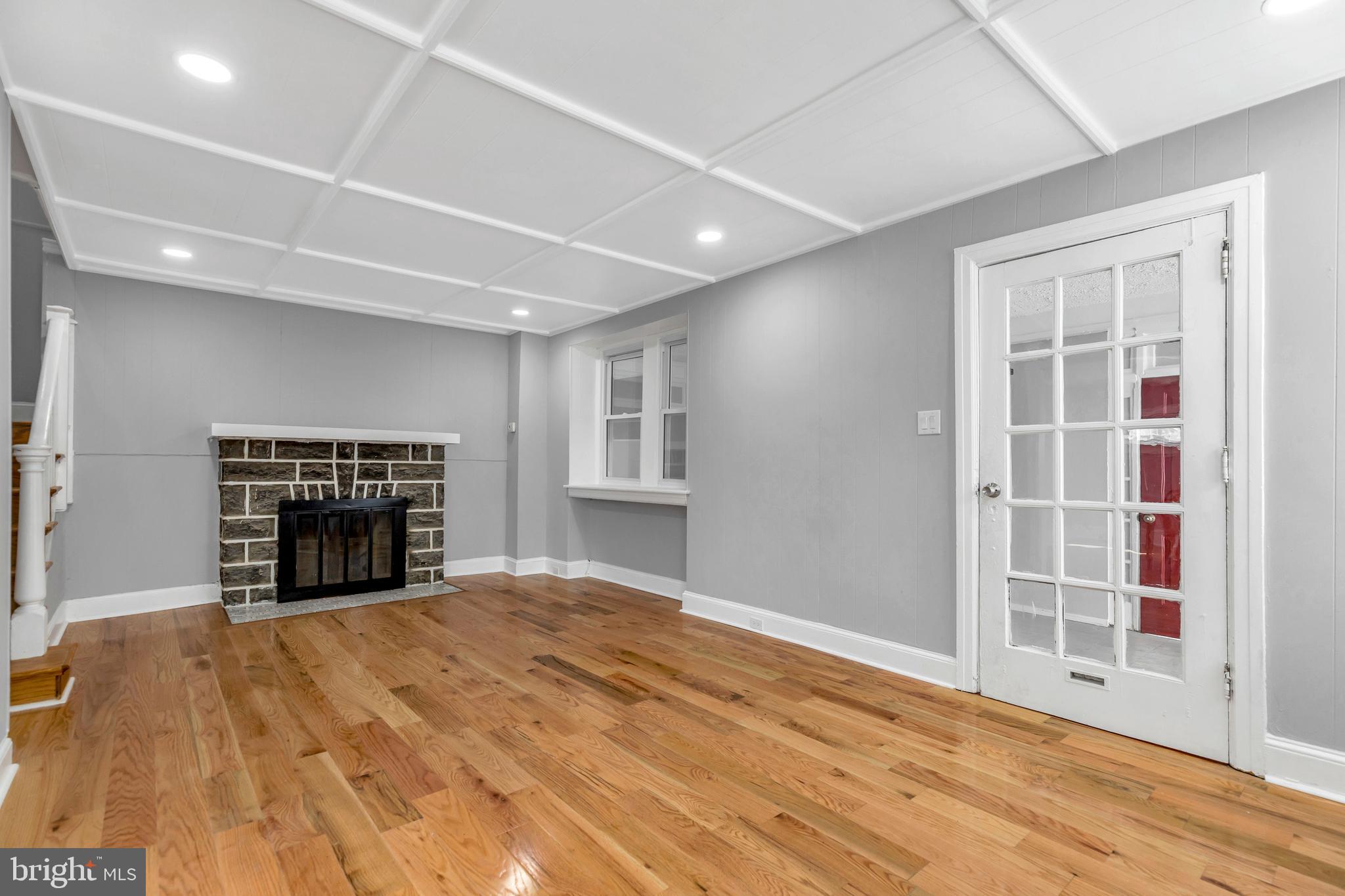 120 Englewood Road Upper Darby, PA 19082 - Photo 7 of 29 a view of an empty room with a fireplace and a window