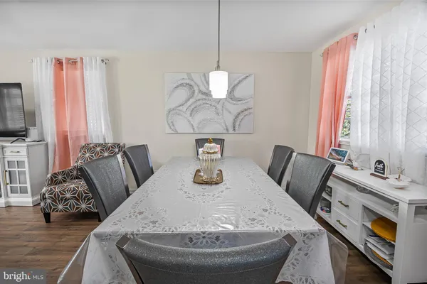 a view of a dining room with furniture and a fireplace