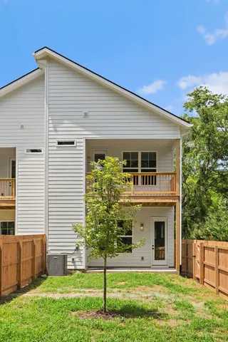 an aerial view of residential houses with outdoor space and street view