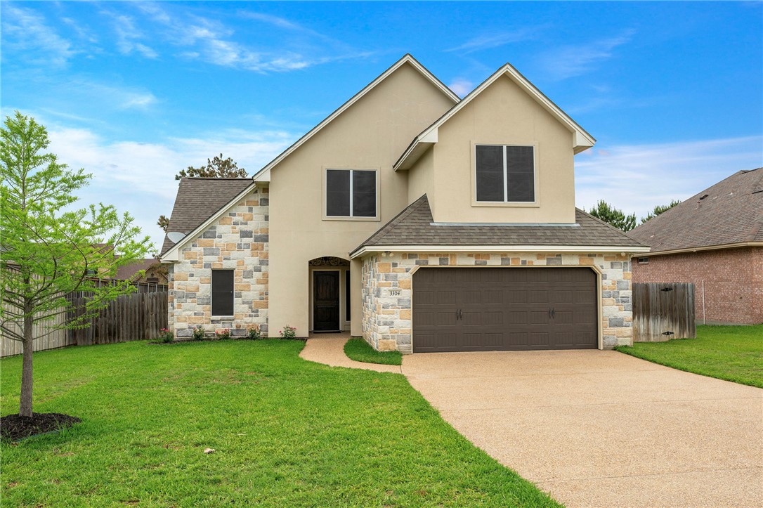3304 Keefer Loop College Station, TX 77845 - Photo 1 of 21 a front view of a house with a yard and garage