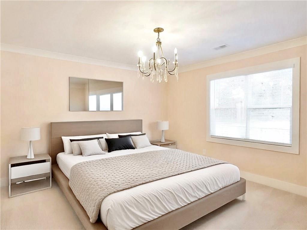 4925 Cook Road Southwest Stockbridge, GA 30281 - Photo 12 of 32 a bedroom with a bed and a window