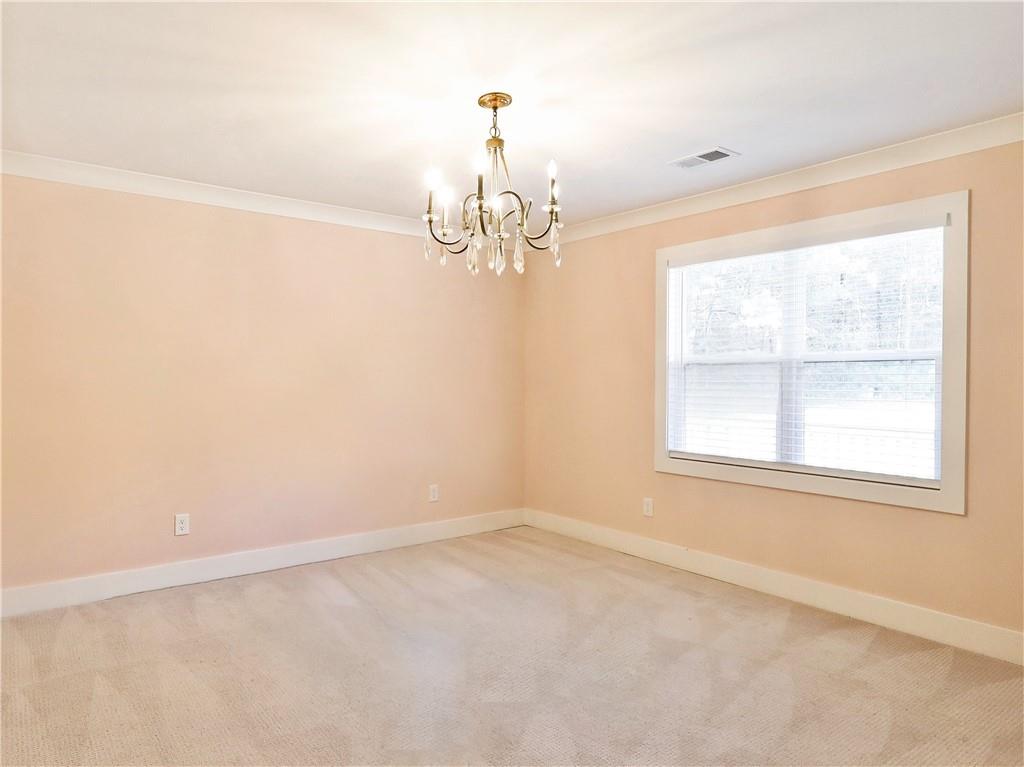 4925 Cook Road Southwest Stockbridge, GA 30281 - Photo 15 of 32 an empty room with a window