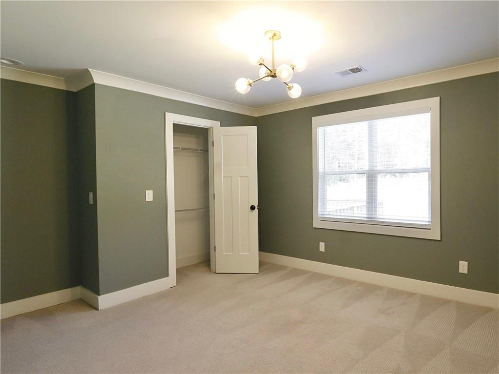 4925 Cook Road Southwest Stockbridge, GA 30281 - Photo 16 of 32 a view of an empty room with a window
