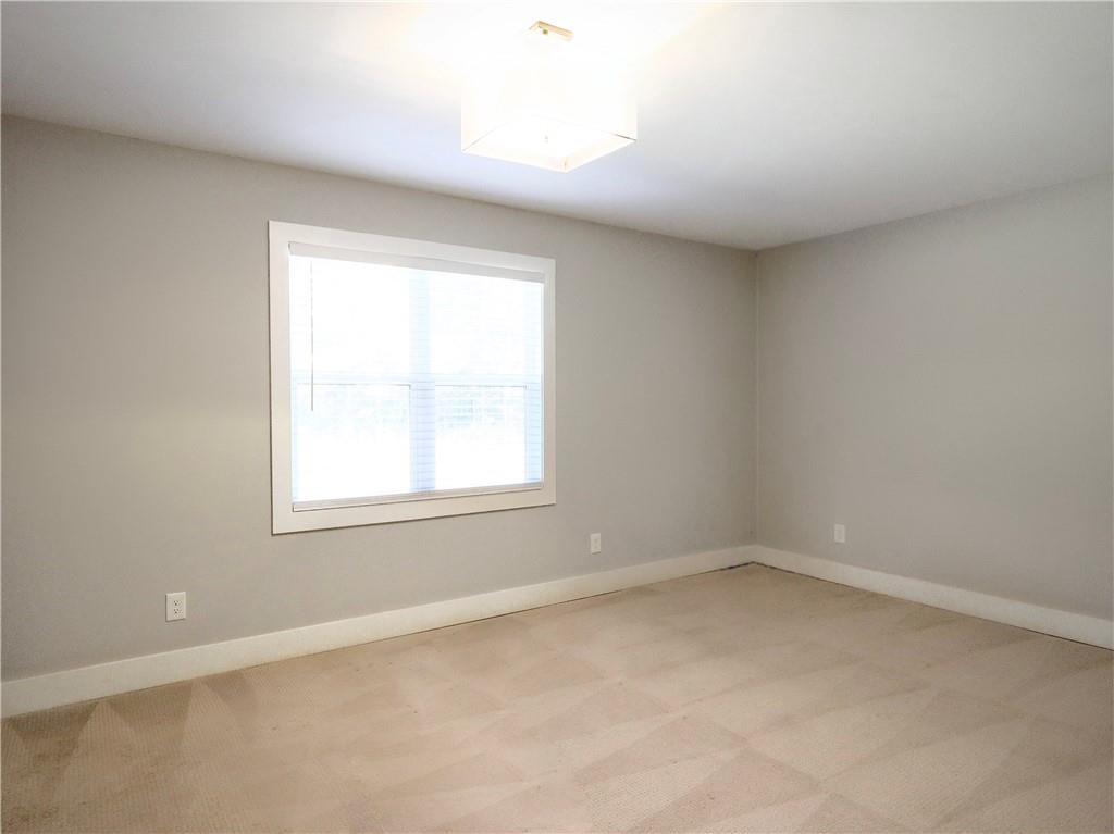 4925 Cook Road Southwest Stockbridge, GA 30281 - Photo 19 of 32 an empty room with a window