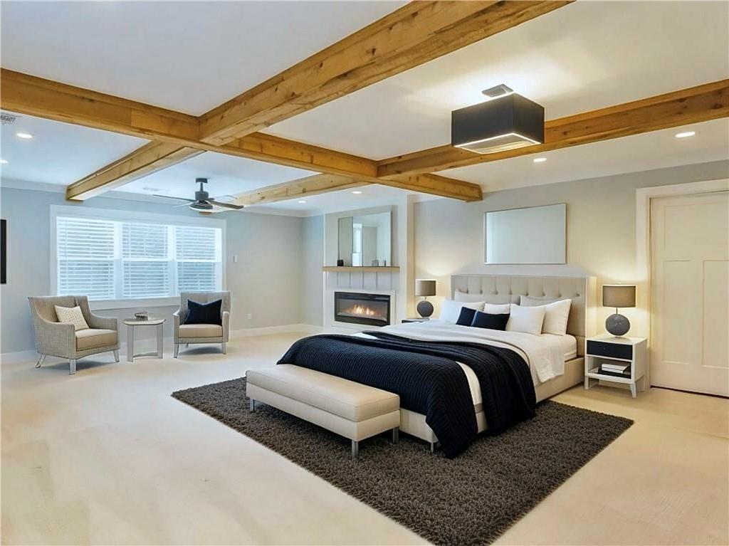 4925 Cook Road Southwest Stockbridge, GA 30281 - Photo 23 of 32 a bedroom with a large bed and furniture