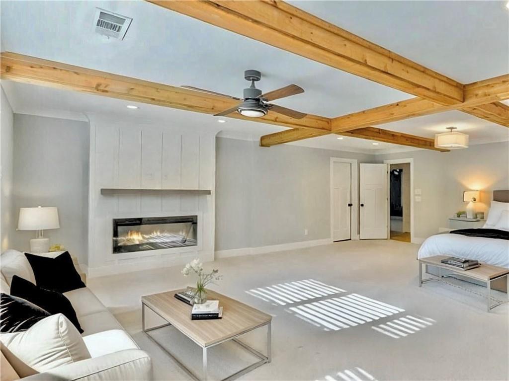 4925 Cook Road Southwest Stockbridge, GA 30281 - Photo 24 of 32 a living room with furniture and a fireplace