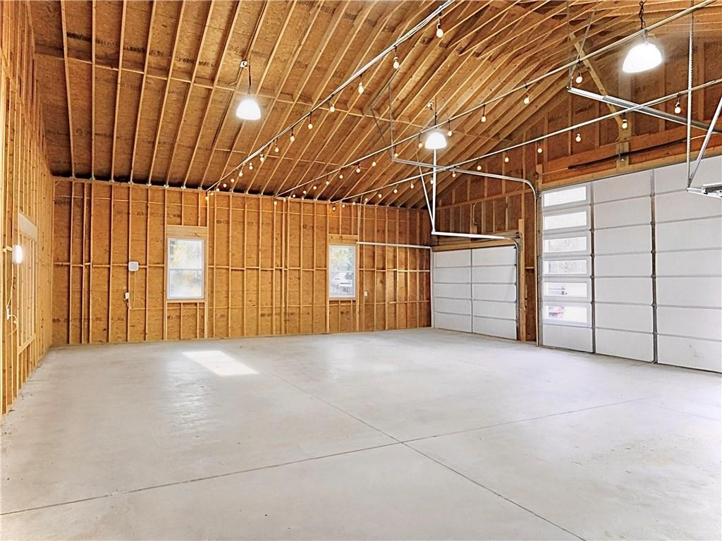 4925 Cook Road Southwest Stockbridge, GA 30281 - Photo 32 of 32 a view of a garage with wooden walls