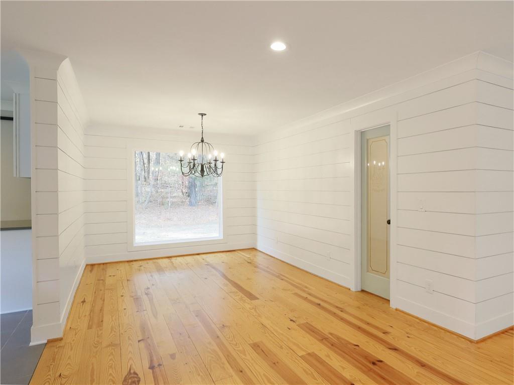 4925 Cook Road Southwest Stockbridge, GA 30281 - Photo 6 of 32 a view of empty room with wooden floor and fireplace