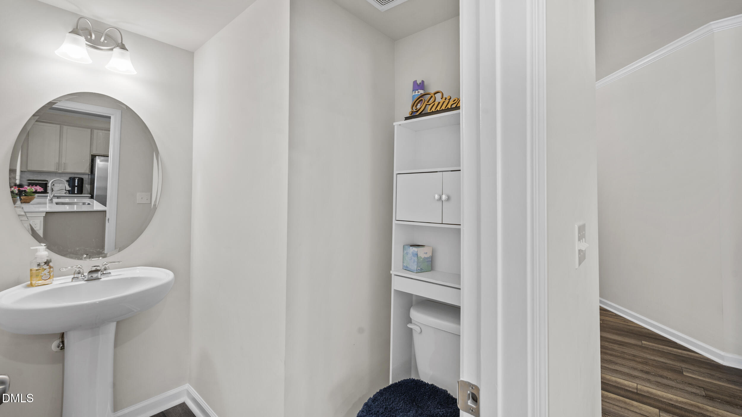 333 Glacier Lk Drive Raleigh, NC 27610 - Photo 13 of 32 a bathroom with a sink and a mirror