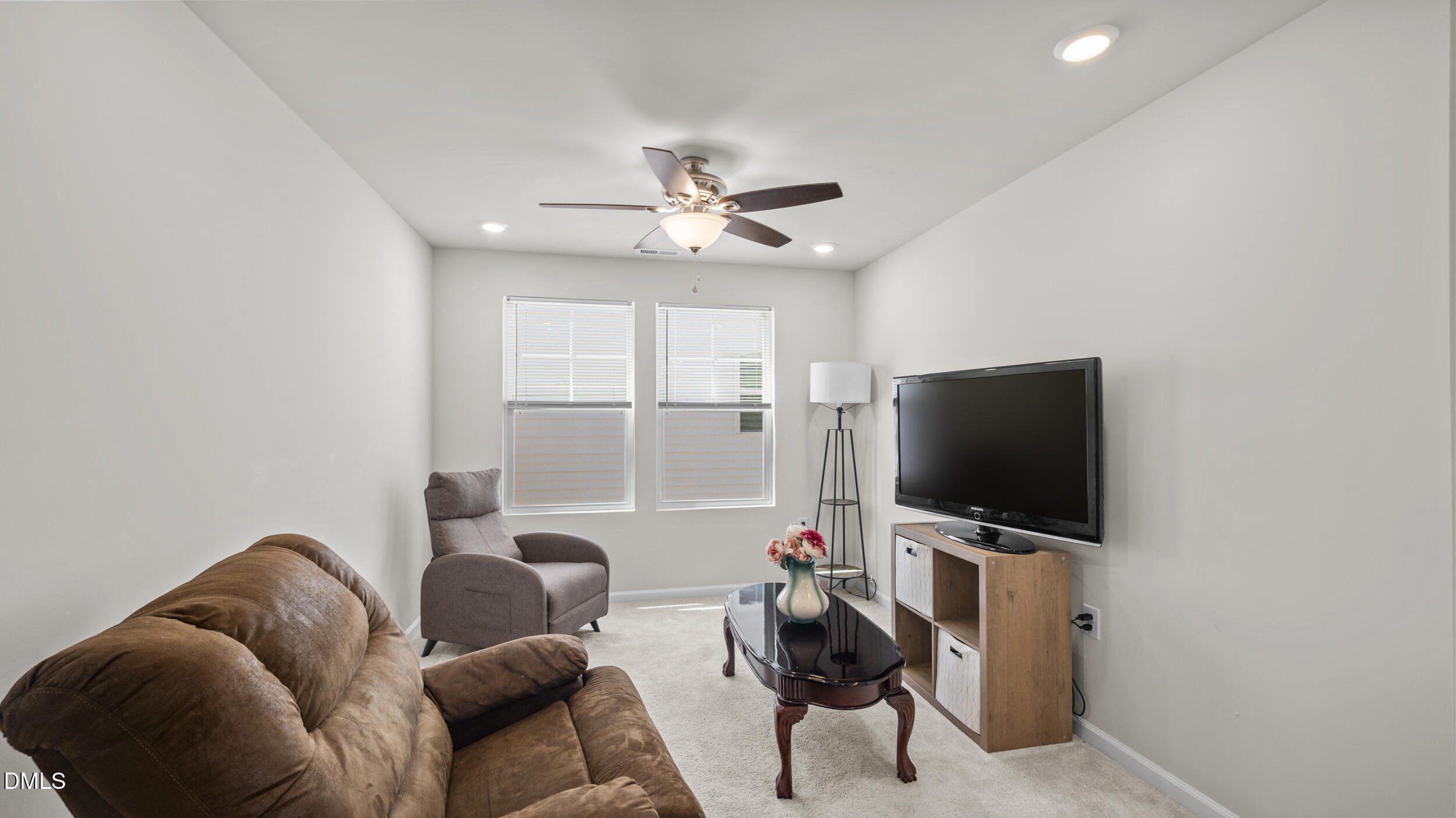 333 Glacier Lk Drive Raleigh, NC 27610 - Photo 15 of 32 a living room with furniture and a flat screen tv