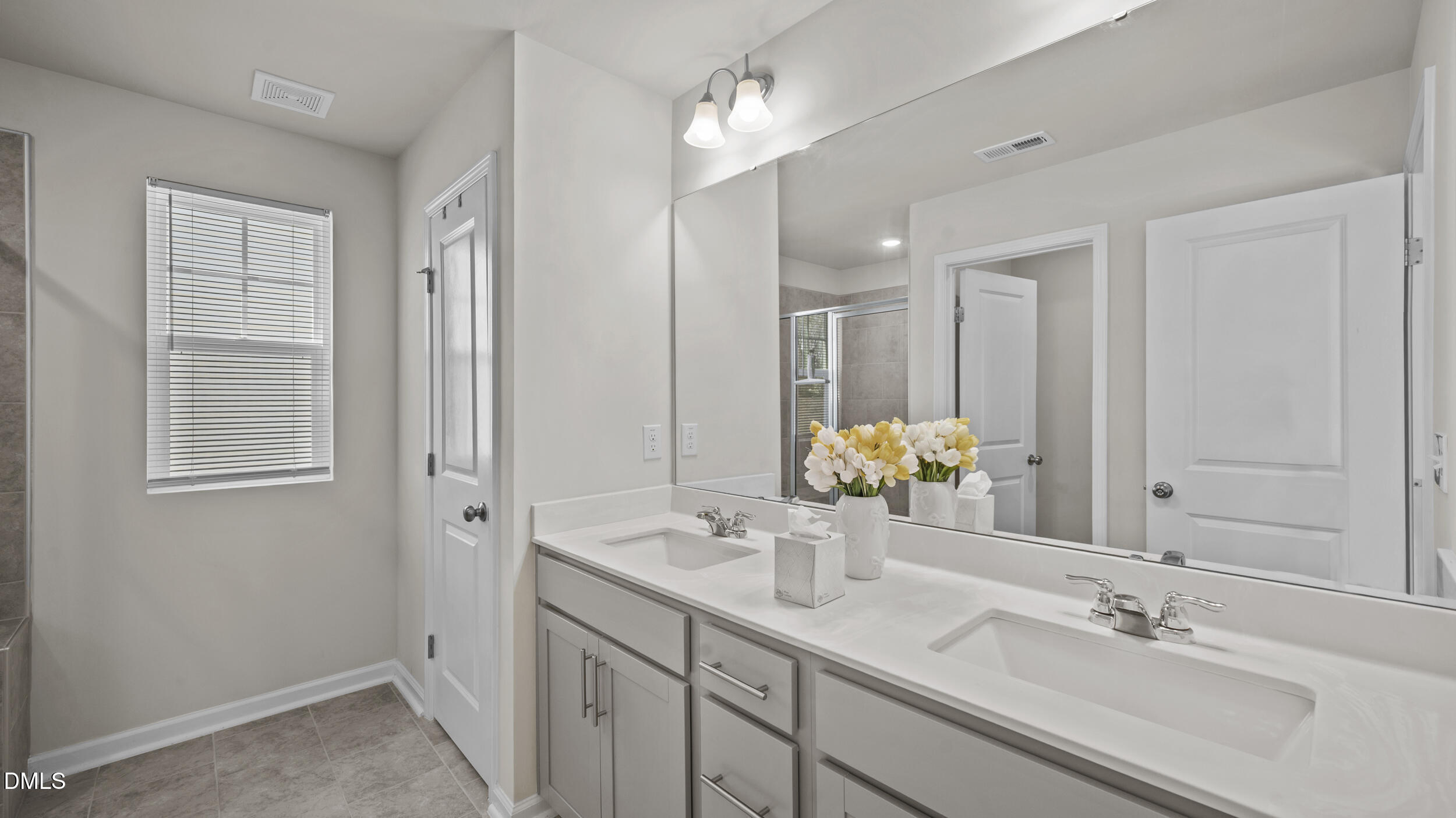 333 Glacier Lk Drive Raleigh, NC 27610 - Photo 18 of 32 a bathroom with double vanity sinks and a mirror