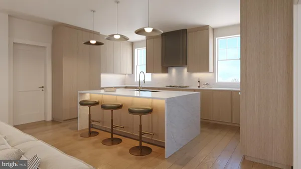 a kitchen with a sink cabinets and window