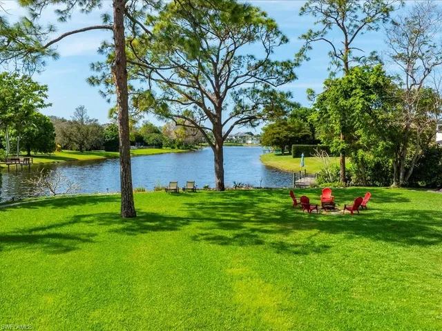 a view of a house with backyard porch and sitting area