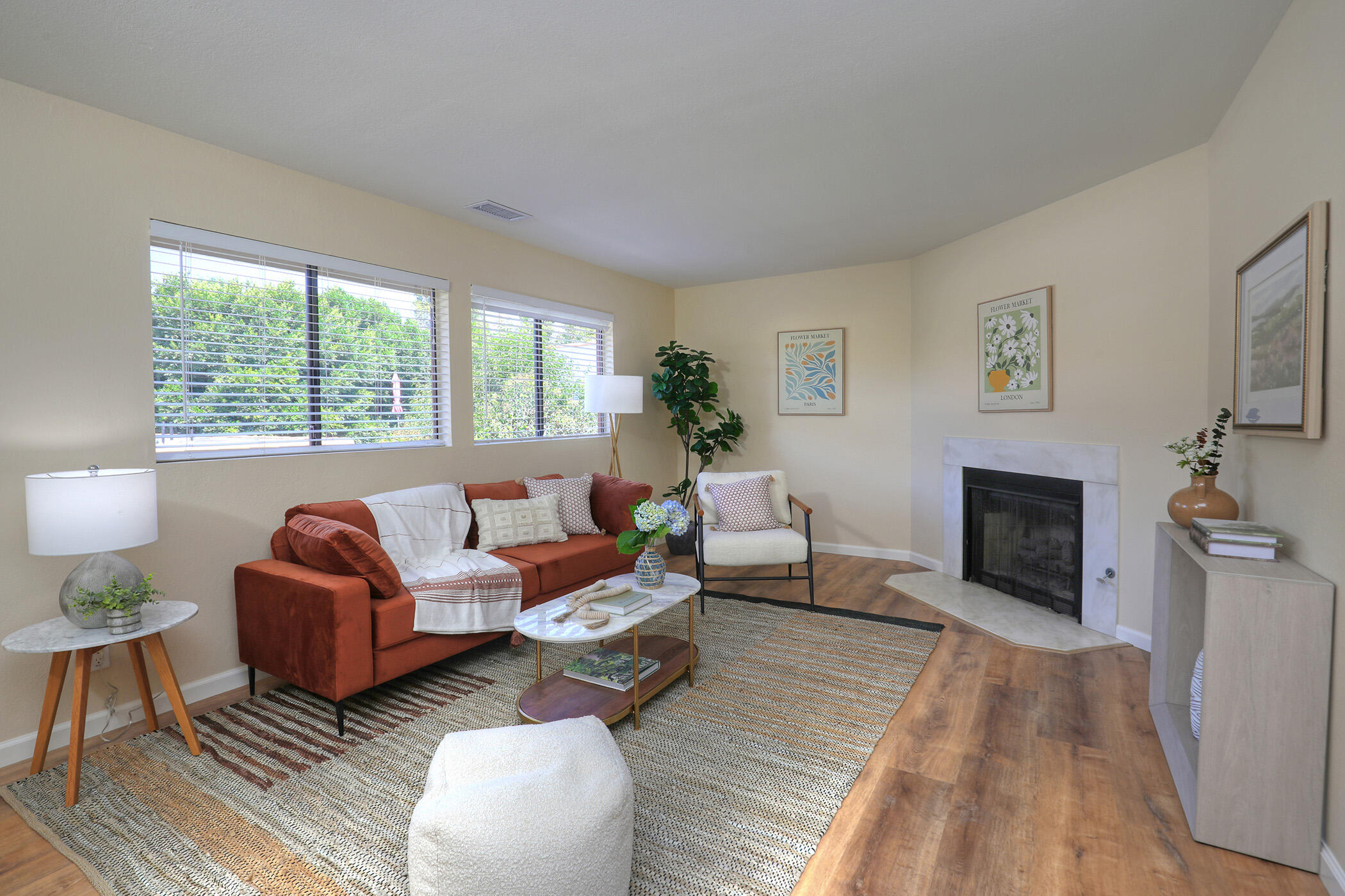 a living room with furniture and a fireplace