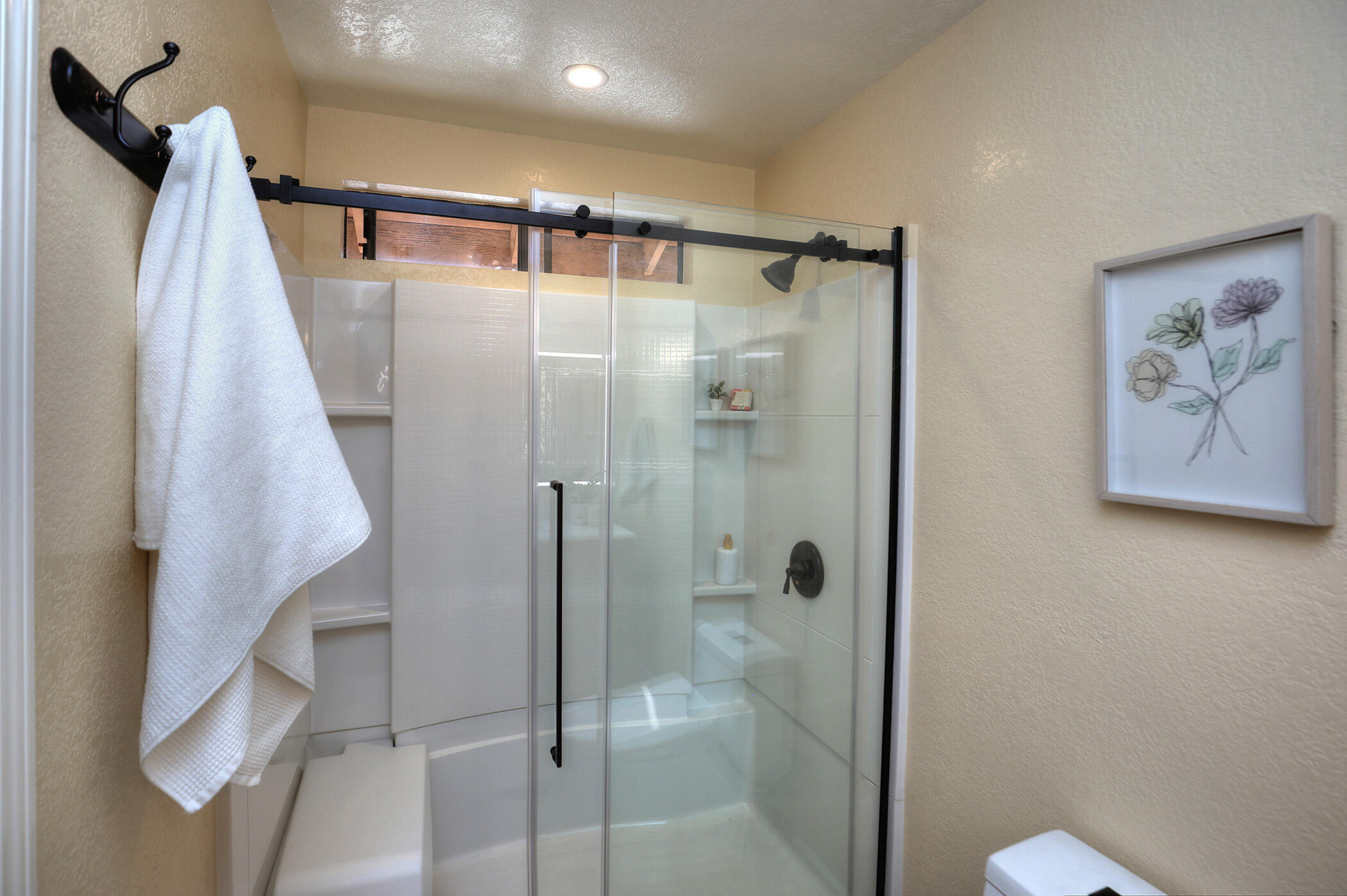 1815 Bath Street, Unit 4 Santa Barbara, CA 93101 - Photo 11 of 19 a bathroom with a shower and a glass door