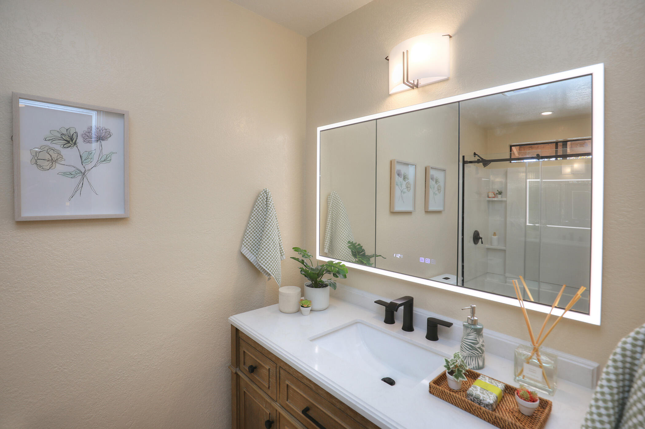 1815 Bath Street, Unit 4 Santa Barbara, CA 93101 - Photo 10 of 19 a bathroom with a sink and a mirror