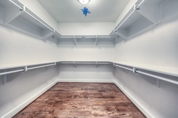 a view of a room with a wooden floor