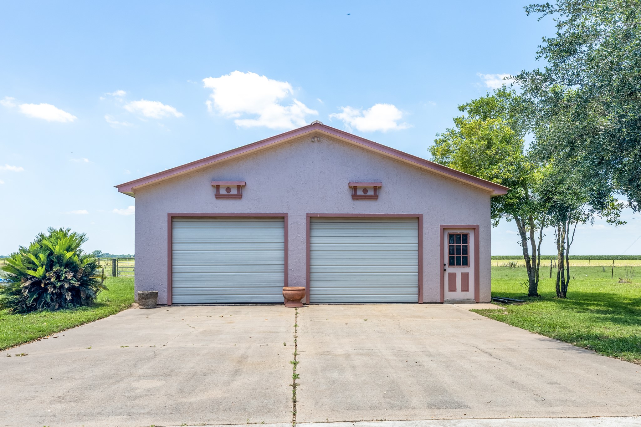 2009 FM 950 Road Eagle Lake, TX 77434 - Photo 19 of 27 a house with a yard and garage