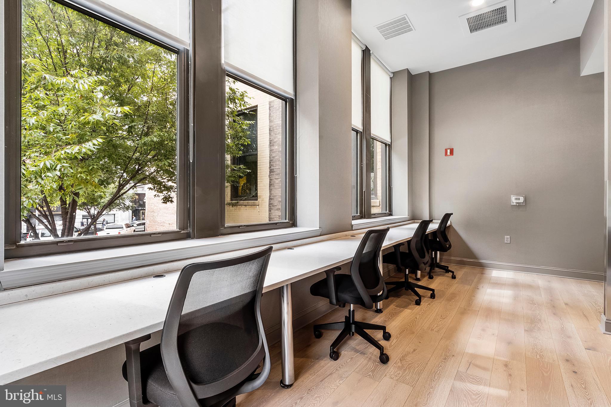 7 North Calvert Street, Unit 1BR Baltimore, MD 21202 - Photo 14 of 32 a view of a workspace with furniture and a window