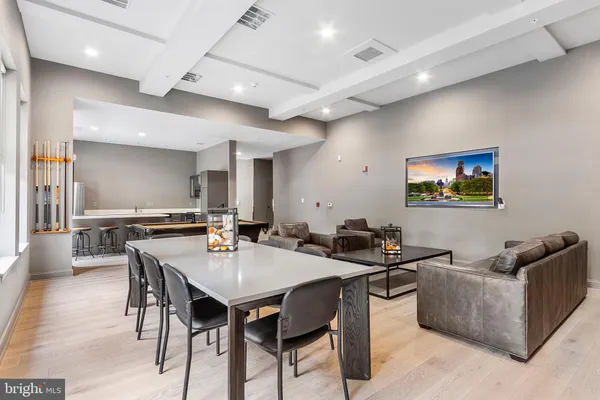 a kitchen with stainless steel appliances a refrigerator and a stove top oven