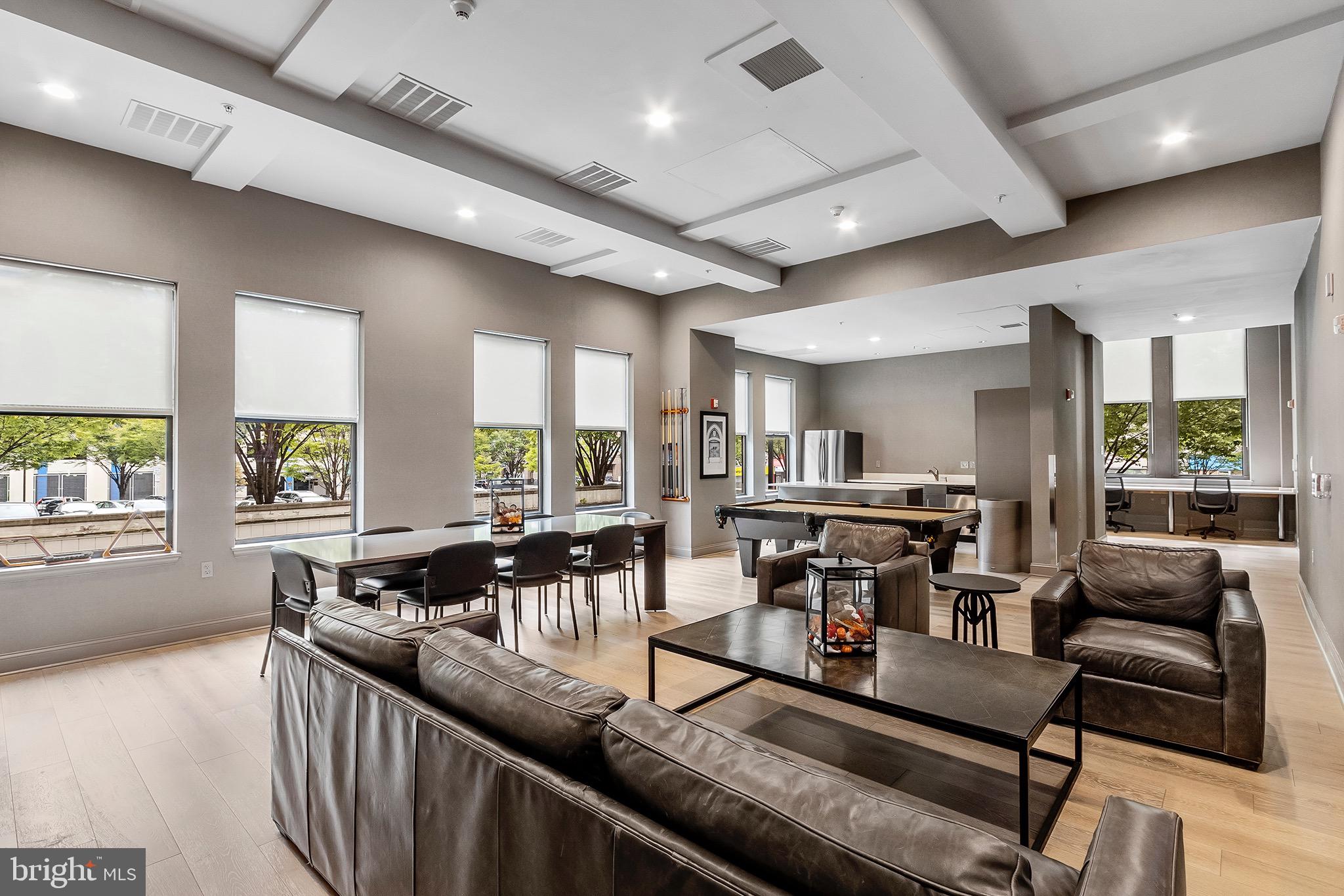 7 North Calvert Street, Unit 1BR Baltimore, MD 21202 - Photo 23 of 32 a living room with furniture and windows