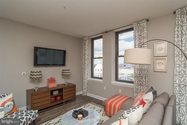 a living room with furniture and a large window