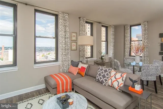 a living room with fireplace furniture and a flat screen tv