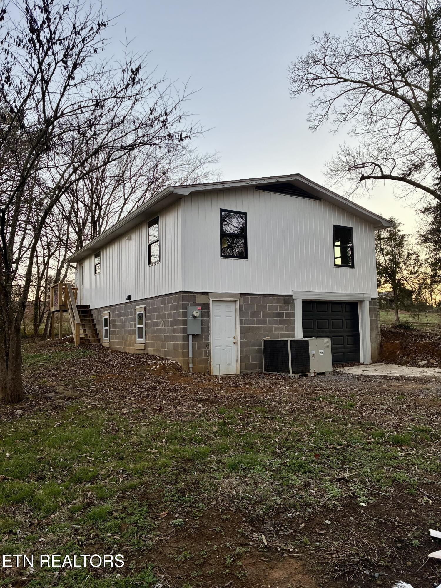 101 Steele Road Greenback, TN 37742 - Photo 3 of 22 a house that has a tree in front of the house