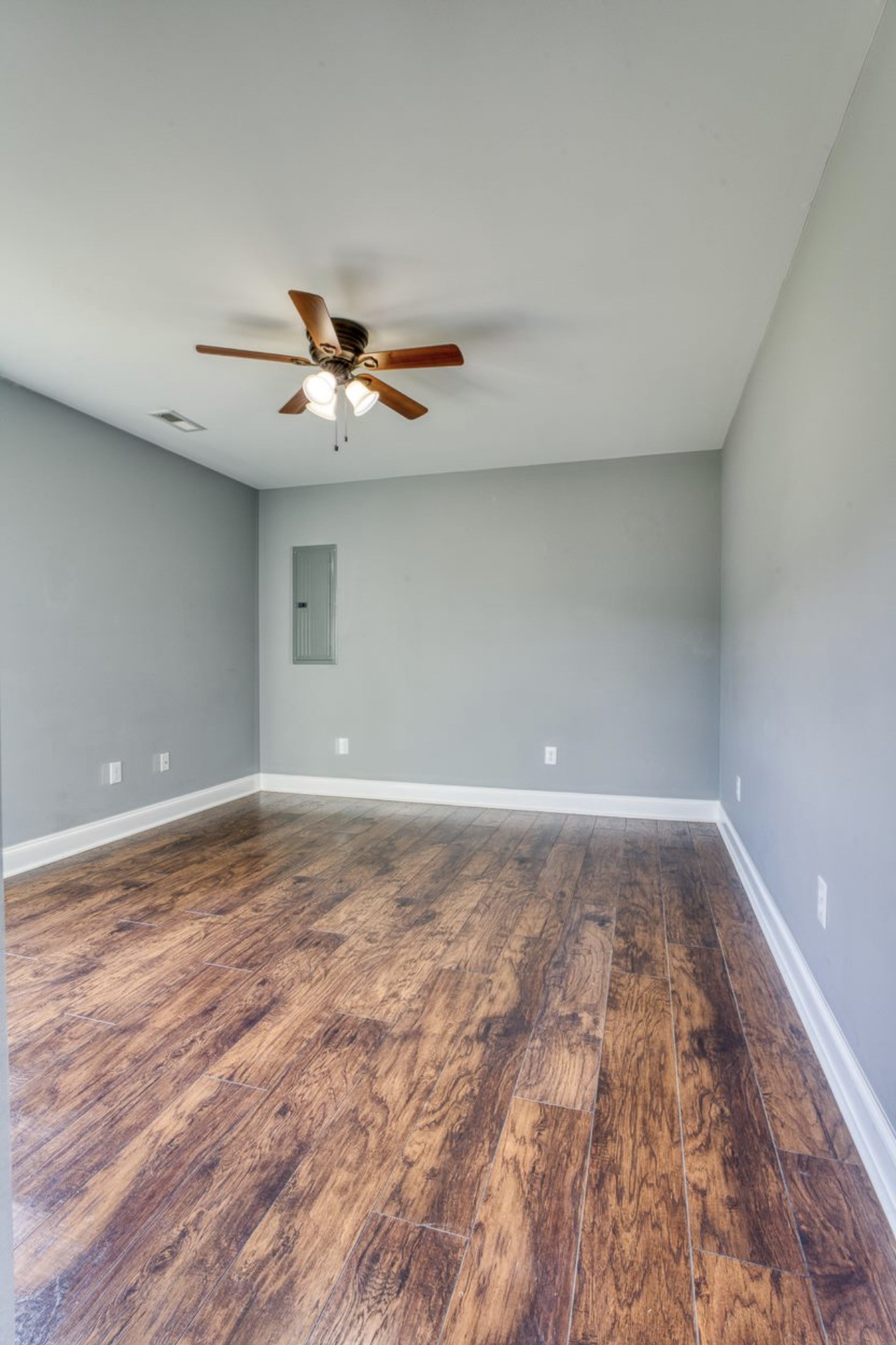 807 Clear Creek Road Pulaski, TN 38478 - Photo 10 of 17 a view of a room with wooden floor and a ceiling fan