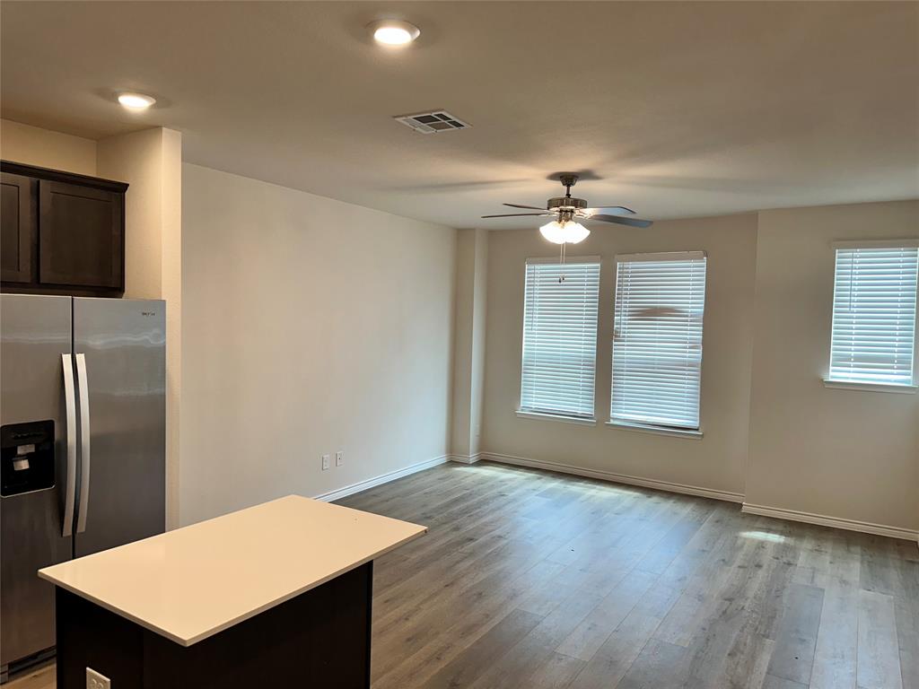 2157 Crooked Bow Drive, Unit 2157 Mesquite, TX 75149 - Photo 6 of 8 a view of a workspace with furniture and a window