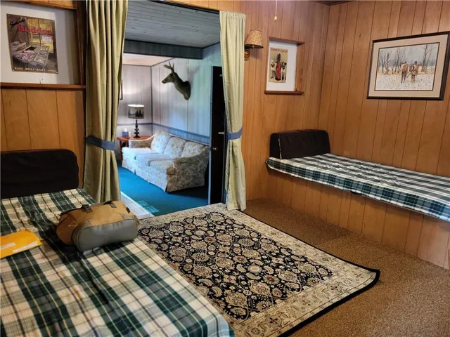 a bedroom with bed and furniture