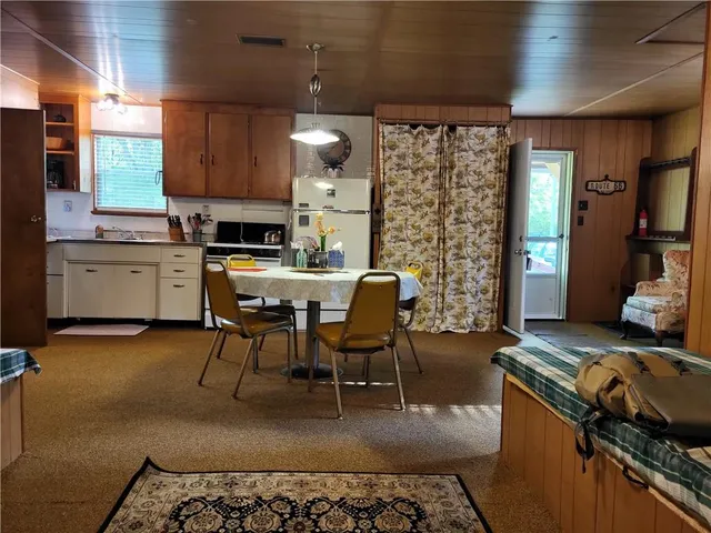 a kitchen with sink cabinets and furniture