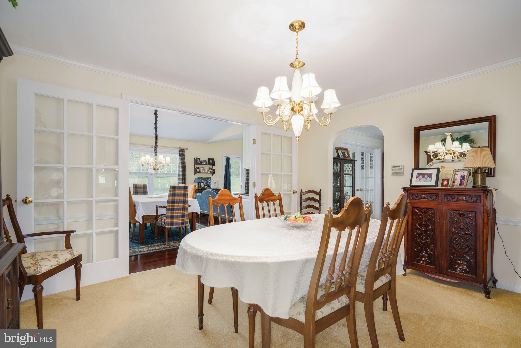 624 Warwick Road Haddonfield, NJ 08033 - Photo 14 of 43 a view of a dining room with furniture and chandelier